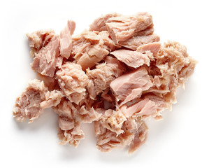 Heap of canned tuna isolated on white, from above