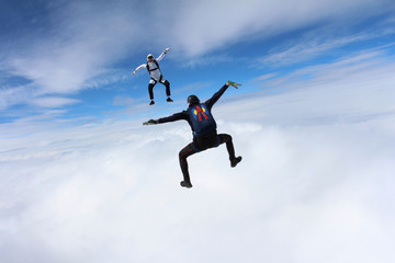 Naklejka na ściany i meble Skydivers are having fun in the sky