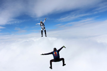 Fototapeta na wymiar Skydivers are having fun in the sky