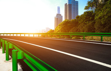 Empty road surface floor with city landmark buildings