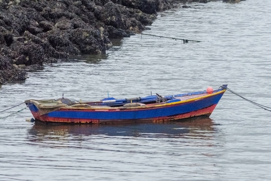 wooden fishing boat on the coast