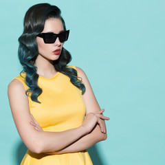 Fashion portrait of stylish woman in sunglasses.
