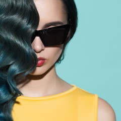 Close-up portrait of stylish woman in sunglasses.