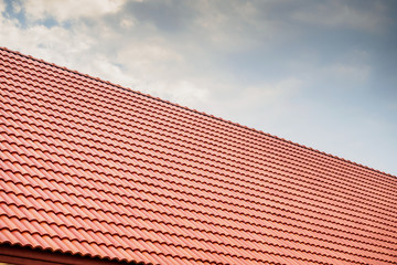 house roof tiles with clouds and sky