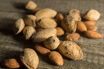 Top view of Almonds over rustic wooden background