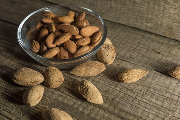 Top view of Almonds over rustic wooden background
