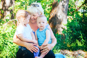 Adult women with two children on her knees