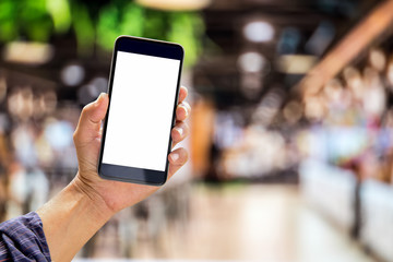 Cropped image of man using a smartphone, looking blank screen while resting in cafe. Blank screen mobile phone for graphic display montage.