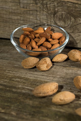 Top view of Almonds over rustic wooden background