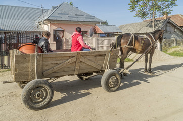 Beautiful scene of country life in the rural village of Toceni, Craiova, Romania, with wooden cart pulled by horse
