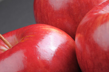 Closeup of red apples on black background