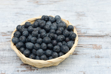blueberries in the basket on wood