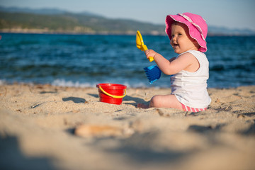 Caucasian little girl playing with bach toys