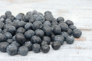 many blueberries lying on wood