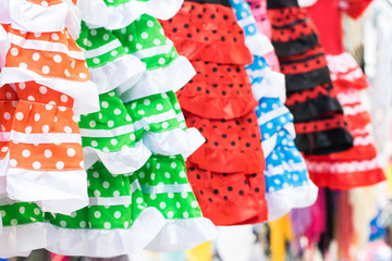Flamenco dresses in a street market.