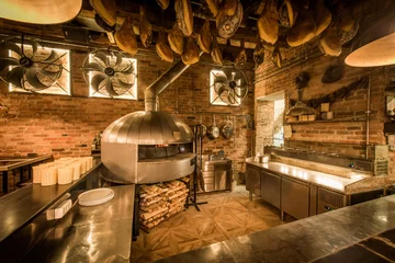 Foto auf Glas Pizza oven in open kitchen italian restaurant © poplasen