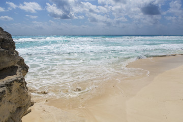 View to the sea on the beaches of the Caribbean ocean. Sunny summer day. Nobody on the beach. Silent destination. Vacation concept image.