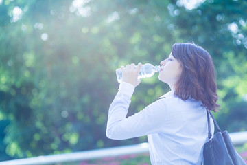 hydration concept. a young woman drinking a bottle of water.