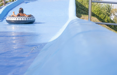 Children playing on water slider