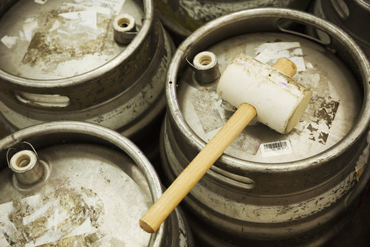Metal beer kegs and a solid hammer to hammer in the airtight bungs. 