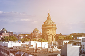 Germany, Baden-Wuerttemberg, Mannheim: Skyline of city center with old Water Tower and blue sky in...
