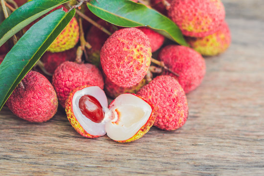 Fresh litchi fruit on an old wooden background