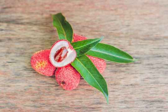 Fresh litchi fruit on an old wooden background