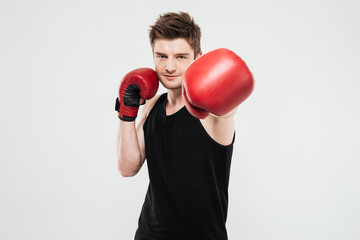 Concentrated young sportsman boxer