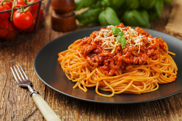 Delicious spaghetti served on a black plate