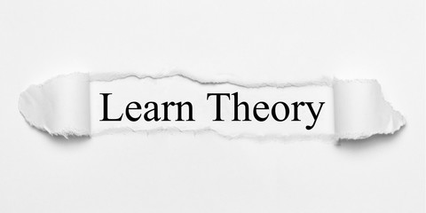 Obraz premium Learn Theory on white torn paper