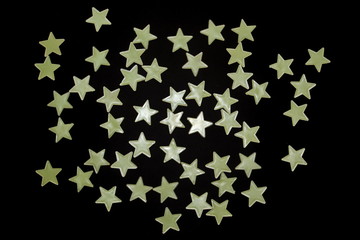 randomly chaotic scattered fluorescent toy glowing stars like night sky on a black background
