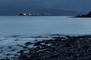 Fenit Pier with lights at Twilight in County Kerry, Ireland