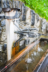 Fototapeta na wymiar close up pf running water from fountain in Swiss - mineral water