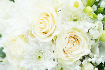white fresh roses, freesia and mum flowers wediing bouquet close up