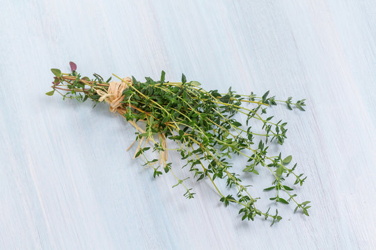 Food background of herb thyme on kitchen table