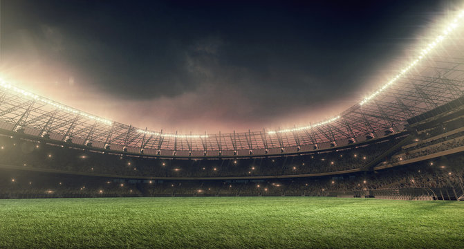 soccer stadium with green grass, illumination lights and dramatic night sky