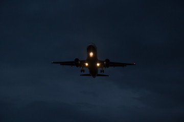 The plane lands at night