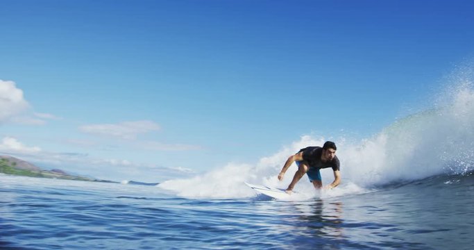 Young Man Surfing Ocean Wave in Slow Motion