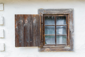 National Museum Pirogovo in the outdoors near Kiev. An old antique window in a vintage peasant white house in Ukraine.