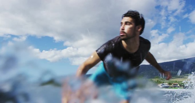 Young Man Surfing Ocean Wave in Slow Motion