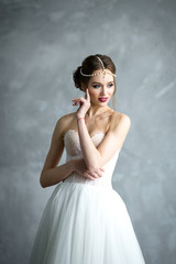 Portrait of a beautiful bride. Bride's fees in the studio