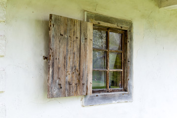 National Museum Pirogovo in the outdoors near Kiev. An old antique window in a vintage peasant white house in Ukraine.