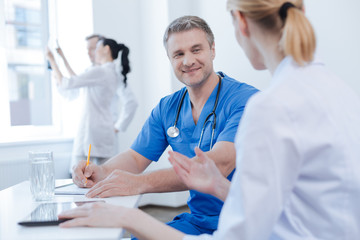 Energetic doctors enjoying discussion at the hospital