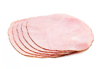 Thin slices of ham on white background.