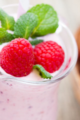Raspberry milk shake with mint decor.