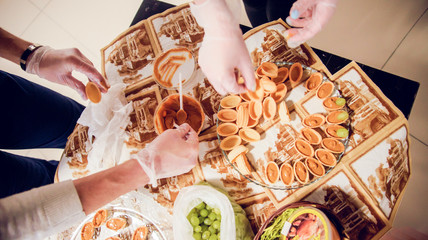 Knife smeared on bread something. Woman hands
