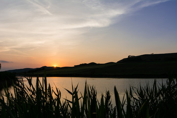 Fototapeta na wymiar Beautiful colors of the sunset over the lake