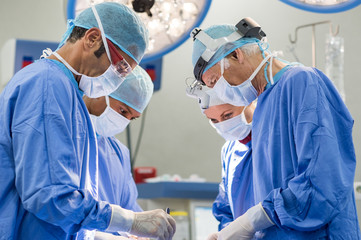 Team of surgeons operating