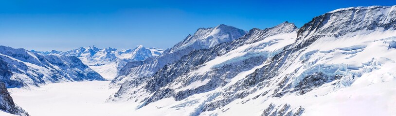 Fototapeta na wymiar Jungfraujoch, Switzerland - April 29, 2017: Panorama view of the Alps mountains from the view of Jungfraujoch station, Switzerland..