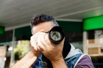 Male photographer taking picture